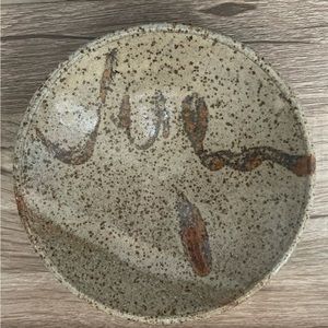 Handmade catchall trinket dish with speckles. Muted beige/brown
